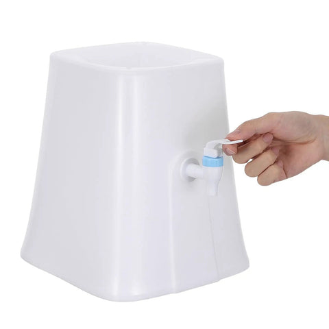 Hand operating spout on compact desktop water dispenser fits 1.2 to 5 gallon bottles ideal for desk dorm room office use
