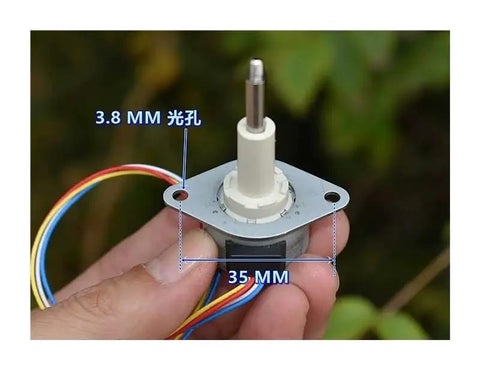 25mm Precision Linear Actuator For Stepper Motors, 20mm Stroke, 3.8mm mounting holes, wires shown, held in hand outdoors