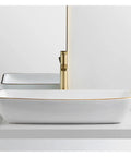 USZWBY Bathroom Vessel Sink Modern Ceramic Vessel Bowl Sink in Decor Golden Top Mount Bathroom Sinks Above Counter Rectangle Vanity Countertop Sink Bowl, WHI at an angle with a golden faucet.