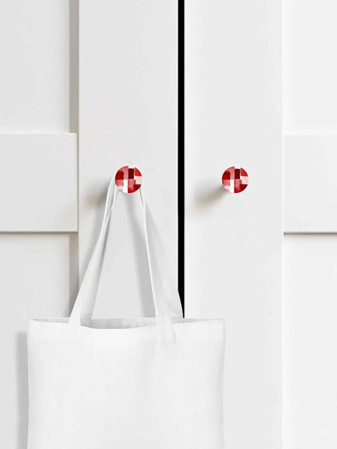 Premium 2 Piece Christmas Cabinet Knobs And Drawer Pulls Featuring A 1.4 Inch Round Design With A Killer Red Abstract Gradient Finish Crafted From Smooth Solid Beech Wood For Sweet Home Renovations on white cabinet with tote bag.