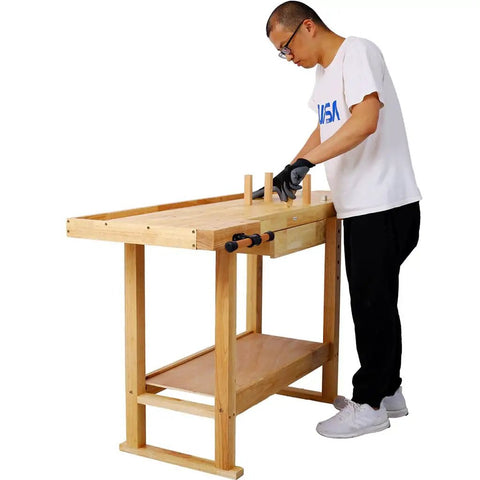 Person using 60 Inch Solid Rubber Wood Workbench With Drawer, Storage Shelf And Adjustable Handles, Beefy 330 Lbs Capacity Tool Bench
