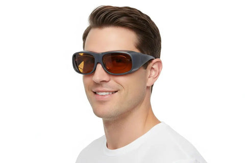 Heavy Duty Laser Safety Glasses For Tattoo Removal showing a man wearing protective glasses with black frames and brown lenses.