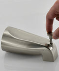 Hand using the pull-up diverter on a Slip Fit Tub Spout with Brushed Nickel Finish for Half Inch Copper Tubing