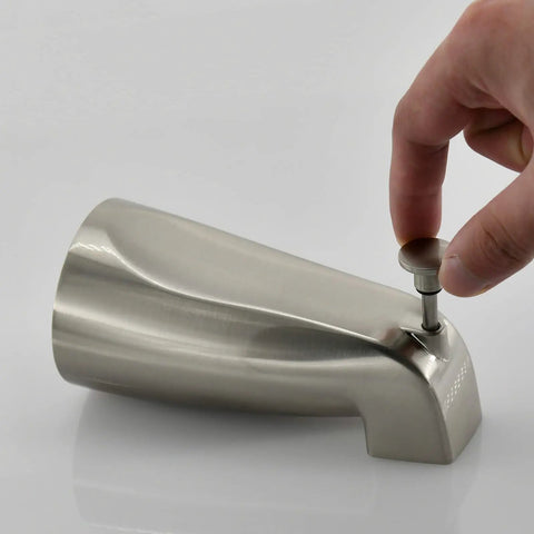 Hand using the pull-up diverter on a Slip Fit Tub Spout with Brushed Nickel Finish for Half Inch Copper Tubing