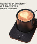 Solidly Built Wireless Charging Mug Warmer And Desk Phone Base With Auto Shut Off Keeps Your Morning Brew Piping Hot While You Charge On The Fly In Classic Black with heart-shaped latte art