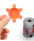 Flexible Rubber Spider Insert For Plum Couplings 40mm Outer Diameter held near heavy-duty jaw coupling pad.