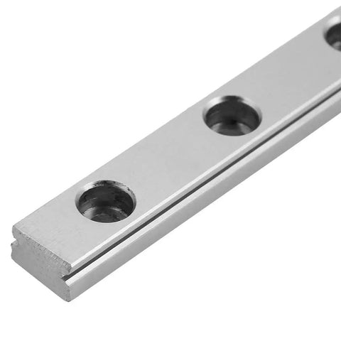 Close-up of 200mm LML9H Miniature Linear Guide Rail with 9mm width showing precision holes for 4-point contact design in motion systems