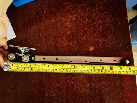 Workhorse Pocket Door Roller Kit With Soft Close, 120 Lbs Capacity, Three Wheel Pocket Door Hanger, shown with measuring tape