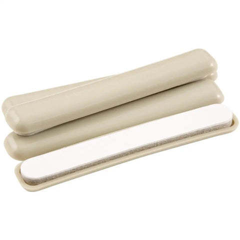 Self Stick One Half Inch By Four Inch Furniture Sliders For Carpet And Hard Surfaces Beige Four Pack, top view showing adhesive