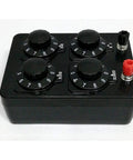 Top view: Acxico resistance box with four rotary dials and red/black terminals for electronics experiments.