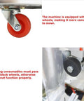 Close-up of automatic liquid filling and packaging sealer's red wheel, showcasing mobility for easier transport.