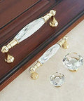 Crystal Drawer Pulls 2 Pack Glass And Zinc Alloy Cabinet Handles with Gold Finish, display on a wooden surface