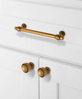 Antique Brass Cabinet Pulls 3 Inch 76mm Pack Of 10 Solid Zinc Alloy Kitchen Cabinet Handles Drawer Hardware No Fuss For Cabinets And Furniture Durable Construction With Easy Install And Pre Drilled Holes installed on white cabinet