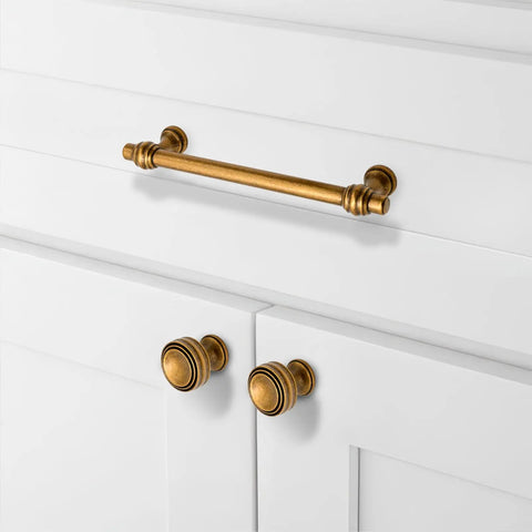 Antique Brass Cabinet Pulls 3 Inch 76mm Pack Of 10 Solid Zinc Alloy Kitchen Cabinet Handles Drawer Hardware No Fuss For Cabinets And Furniture Durable Construction With Easy Install And Pre Drilled Holes installed on white cabinet