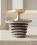 Happyyami Bathtub Drain Stopper Rubber Plug with Handle Leak Proof Seal, gray rubber plug with golden handle design.