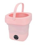 Slick 6.5 Liter Portable Mini Washing Machine With Spin Dryer, No Sweat Compact Foldable Top Loader For Fresh Threads, Ideal For RVs, Dorms, Road Trips, Or Tiny Apartments, Sweet Pink Build, with handle and control panel.