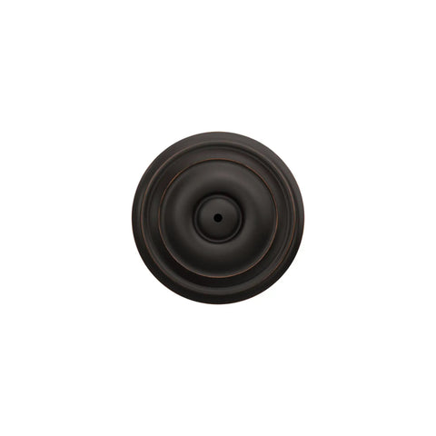Top view of Georgian Privacy Door Knob With Bed And Bath Privacy Lock In Aged Bronze, featuring a circular design