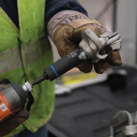 Worker adjusting Two In One Impact Socket With Hands Free Size Swap, fits 1 inch and 13/16 inch, high torque for fast install removal.