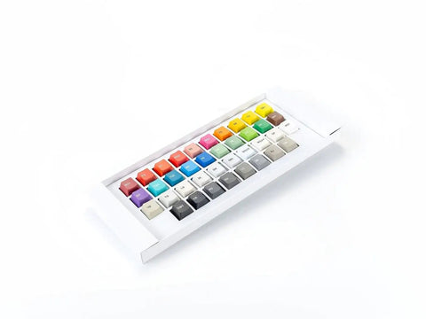 GMK Stock Color Keycaps For Custom Mechanical Keyboard Builds Color Match Ref Made In Germany Premium Double Shot Abs Or Pbt Mx Switch Compatible Look Sick On Your Rig Flex Up Typing Vibe Dope Keys Stylish High End Affordable Value Pick Yours Now. colorful GMK keycaps in tray, angled view