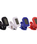 Four colorful electronic clip-on digital tuners in black, white, blue, and red for precise tuning.