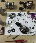 Disassembled fishing reel with Three Piece Fishing Reel Bearing Kit For Shimano Ultegra 3000 4000 5000 Models Includes Eight By One.