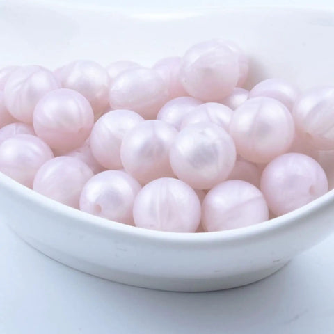 Smooth Premium Silicone Beads For Keychain Making And Jewelry Crafting Assorted Sizes in pale pink color.