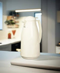 Euro Carafe 1 Liter White Plastic With Vacuum Glass Liner For Hot Beverages Keeps Heat For Hours in a kitchen setting