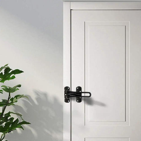 WUUWCHODC Heavy Duty Door Slide Bolt Lock Gate Latch Sliding Security installed on a white door with a green plant nearby.