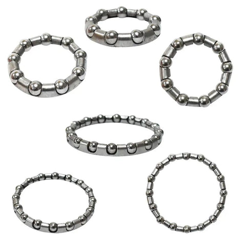 All In One Bike Ball Bearing Headset Retainer Kit With Seven Sizes And Five Sets For Crank And Wheel Bearings From Five To Eight Millimeters And One Sixth To One Third Inch Replacement Parts, showing six circular steel retainers.
