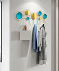 Built Different Wall Mounted Coat Hooks For Entryway with gold and blue circles holding coats and bags, stylish and space-saving.