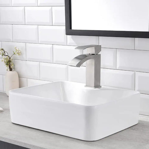 White Rectangle Ceramic Bathroom Vessel Sink And Brushed Nickel Waterfall Faucet Combo, 16x12 Inch Art Basin in a Luxe Vanity Setting