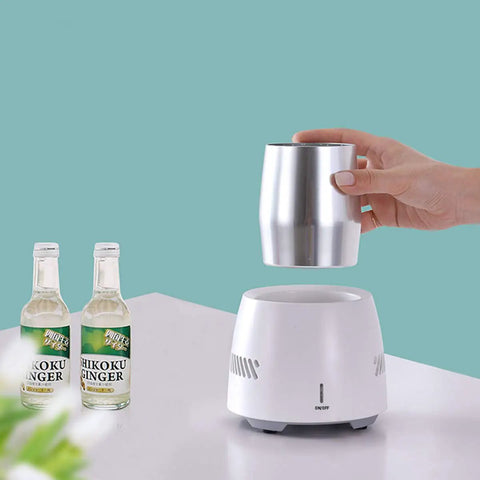 Portable Car Cup Beverage Cooler With Electric Adapter And 350ML Mug 24 Hour Semiconductor Fridge with silver mug and ginger drinks.