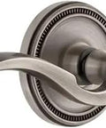 Soleil Rosette Privacy Door Lever Set With Bellagio Lever In Antique Pewter Finish showing side view, solid forged brass.