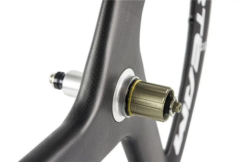 Close-up of 56Mm Carbon Road Bike Tri Spoke Wheelset hub, 23mm wide, 700C clincher, matte 3K finish, compatible for Shimano speeds