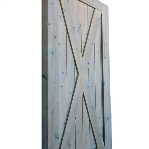 Slick Water Based Aging Wood Stain Yields Authentic Driftwood Gray Finish With One Coat Tannin Bond For Raw Interior Boards on barn door.