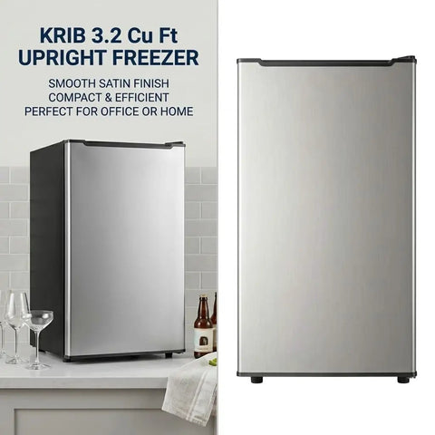 Spare Your Square Footage 3.2 Cubic Foot Upright Freezer In Classic Silver standing beside glasses and bottles on a kitchen countertop.