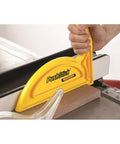 Push Stick for Woodworking Safety with Non Slip TPE Base High Visibility Yellow Handle in use on a table saw for safer cuts