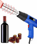Heavy Duty 50Mm PVC Capsule Heat Shrink Gun With Digital Display And Adjustable Speed Control next to a wine bottle and capsule seals.