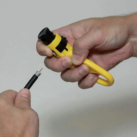 Using a Coax Install And Test Kit With Crimp Tool, Tester, Stripper And Universal F Connectors for easy cable stripping.