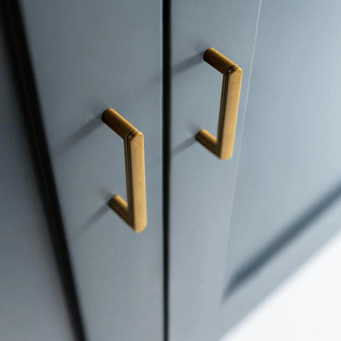 Set Of 6 Cabinet Pulls 3 Inch Center To Center Antique Brass Finish installed on dark cabinetry, showcasing minimalist style.