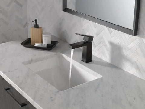 Dope Matte Black Bathroom Faucet For Vanity With Deck Plate Fits 1 Or 3 Hole 4 Inch Installations, shown installed on white marble sink