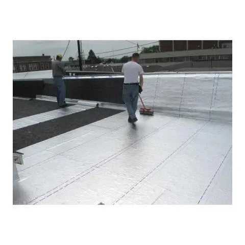 Two workers applying Heavy Duty Self Stick Roll Roofing Gray Waterproof Peel and Seal Tape for RV Trailer Homes on a low slope roof.