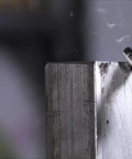 Carbide burr with ball-end mounted in die grinder, 1/4" shank, shiny metal cutting bit