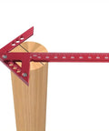 Sick Aluminum Alloy Woodworking Square For Dead Center Layout And 45 90 Degree Angle Measuring Tool With Sharp Scribe Ruler In Bold Red Metric Workshop Finish on a wooden surface.