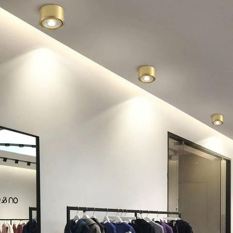 Hella Bright Eight Pack Led Recessed Downlights Swappable Kelvin Brass Trim Eyeball Fixtures Adjustable Directional Beam mounted in a smooth ceiling.