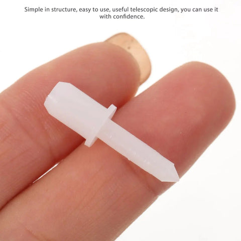 Replacement louver pin in hand, white plastic, 28 x 8 x 8mm, for use with plantation shutters to ensure smooth operation.