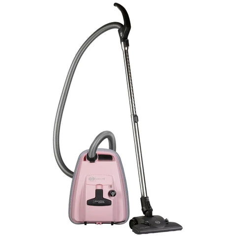 K Series Vacuum Maintenance Kit With Eight Filter Bags, Exhaust Filter And Pre Motor Microfilter beside pink vacuum cleaner