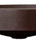 Side view of 16 By 13 Inch Oval Skirted Vessel Copper Sink Hand Hammered Pure Copper Brown Finish For Modern Bath Semi Recessed Vessel One And A Half Inch Drain Opening Eighteen Gauge Handmade In Mexico CPS10.