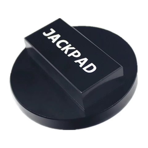 Close-up of black anodized jack pad adapter with round base and rectangular top labeled JACKPAD
