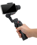 Person holding Grab And Go Handheld Stabilizer For Sports Cameras And Smartphones With 5th Gen Intelligent Stabilization Real Time Motion